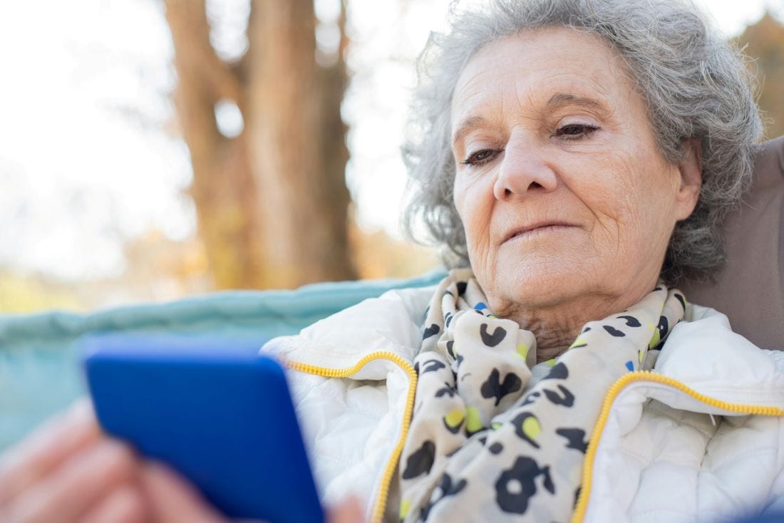Pensioner with Mobile Phone
